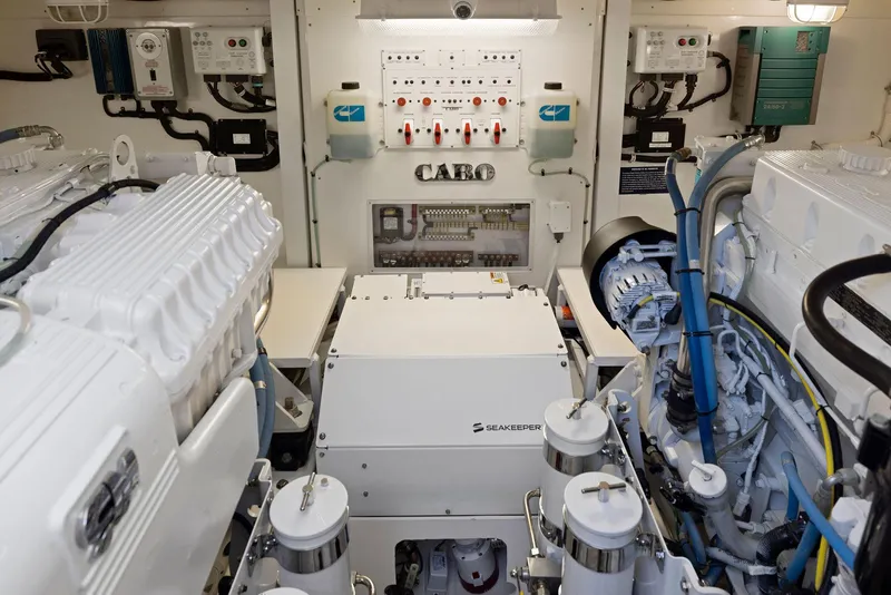 Slide: The Image of Engine room of a 2012 Cabo 44 Hardtop Express yacht. - 44