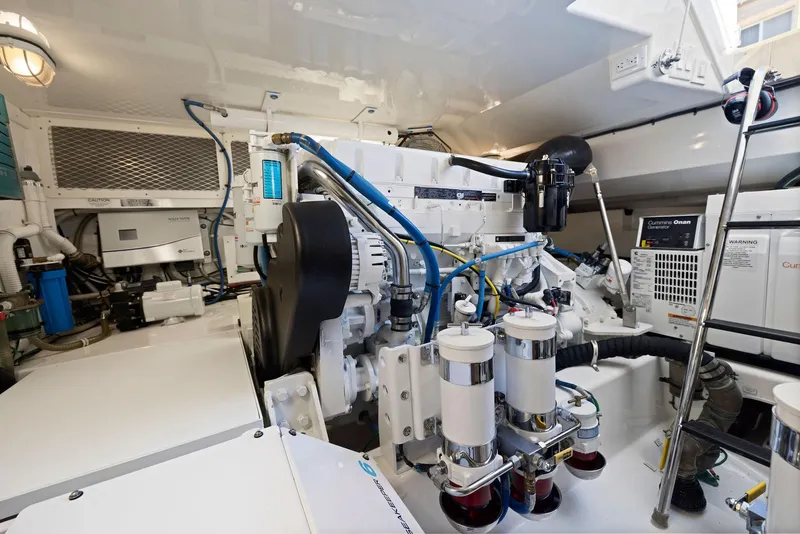 Slide: The Image of Engine room of a 2012 Cabo 44 Hardtop Express yacht. - 48