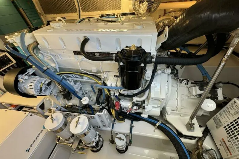 Slide: The Image of Engine room of 2012 Cabo 44 Hardtop Express, showcasing detailed mechanical components. - 72