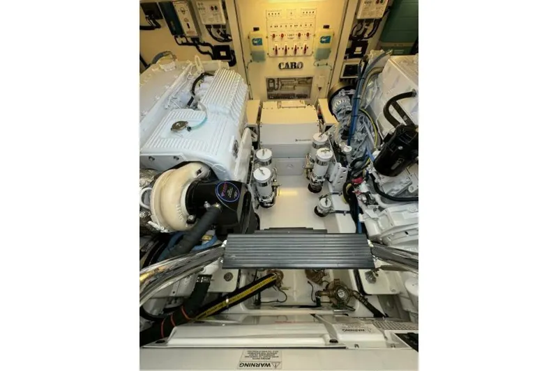 Slide: The Image of Engine room of 2012 Cabo 44 Hardtop Express, showcasing mechanical components and systems. - 73