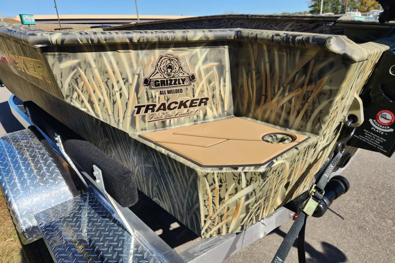 Slide: The Image of 2026 Tracker Grizzly 1756 T Marsh boat with camouflage design on a trailer. - 17