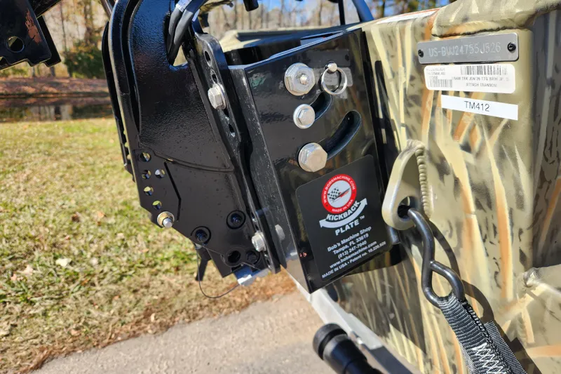 Slide: The Image of 2026 Tracker Grizzly 1756 T Marsh boat transom with Kickback plate and serial details. - 19