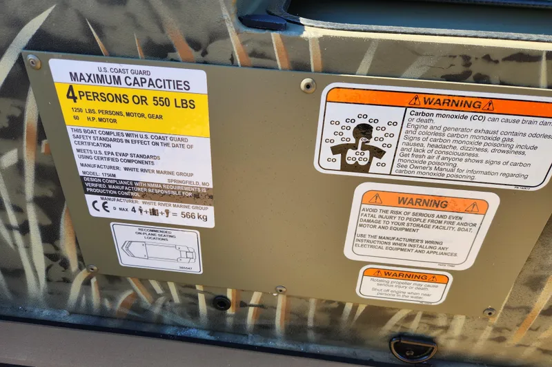 Slide: The Image of Safety warning labels on a 2026 Tracker Grizzly 1756 T Marsh boat. - 20