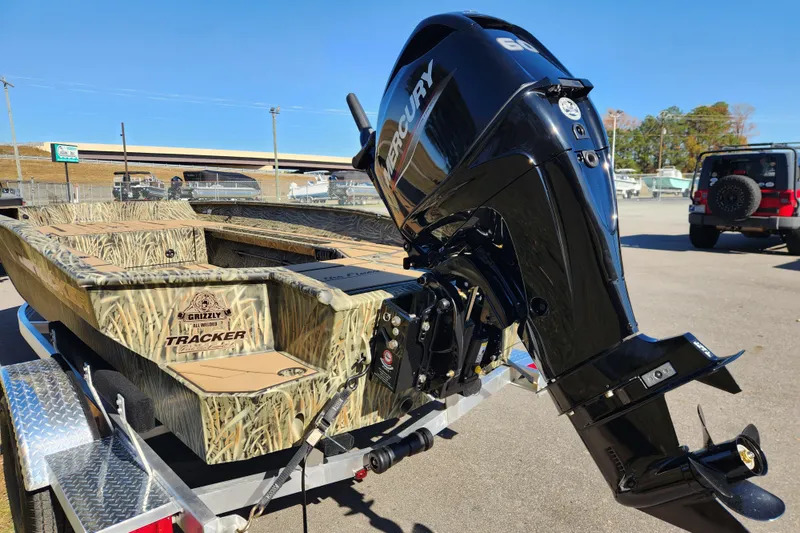 Slide: The Image of 2026 Tracker Grizzly 1756 T Marsh boat with Mercury engine on trailer. - 4