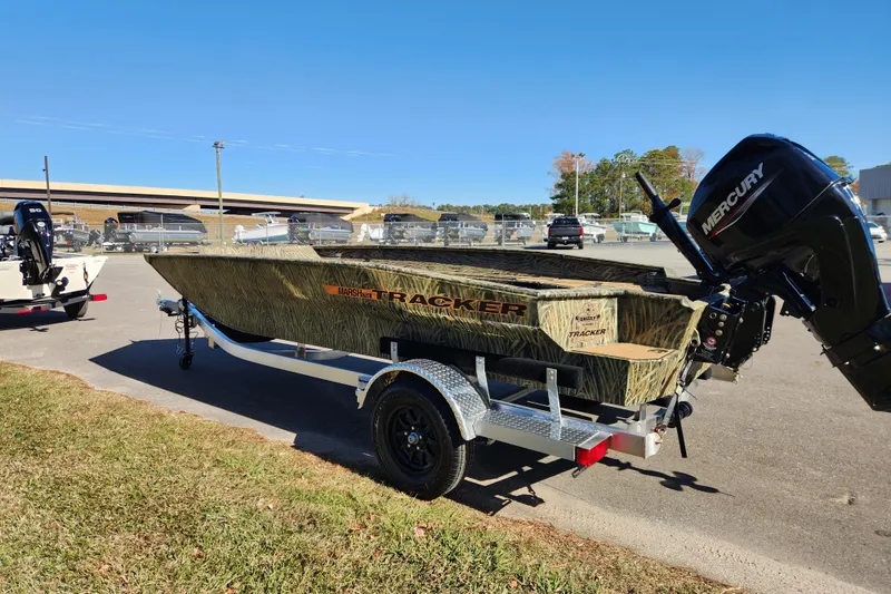Slide: The Image of 2026 Tracker Grizzly 1756 T Marsh boat on trailer with Mercury outboard motor. - 5