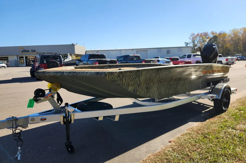 Slide: The Image of 2026 Tracker Grizzly 1756 T Marsh boat on trailer in parking lot. - 7