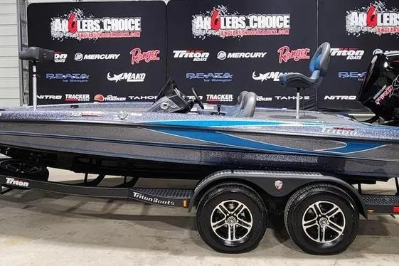 The Image of 2026 Triton 19 TrX Patriot boat on display at Anglers Choice event. - 1