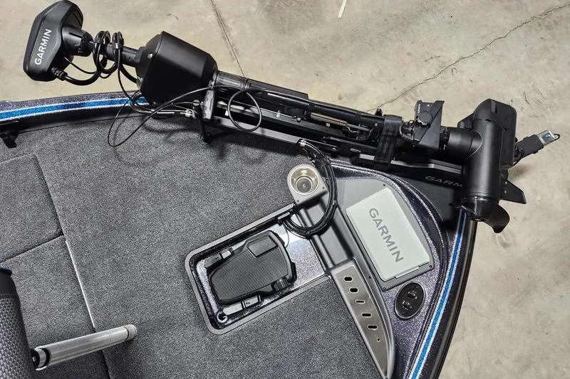 Slide: The Image of Triton 19 TrX Patriot 2026 boat with Garmin equipment and trolling motor on deck. - 8