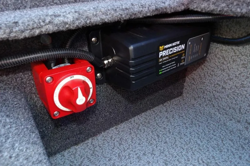 Slide: The Image of 2023 Lund 1675 Adventure SS boat battery switch and Minn Kota Precision charger. - 14