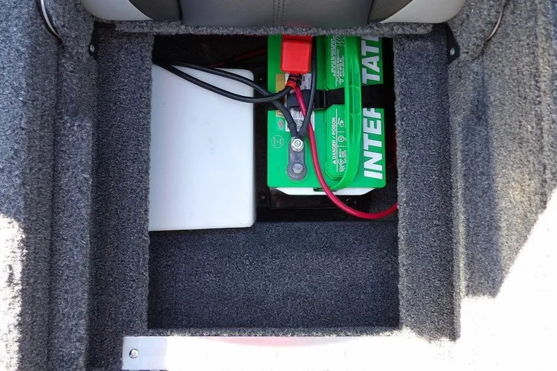 Slide: The Image of Battery compartment of 2023 Lund 1675 Adventure SS boat, featuring an Interstate battery. - 15