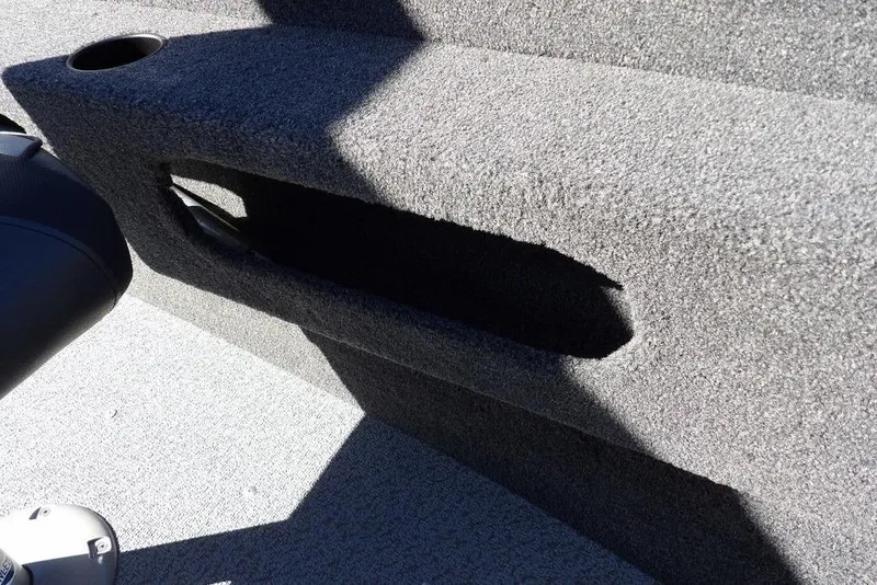 Slide: The Image of 2023 Lund 1675 Adventure SS boat interior with carpeted storage compartment. - 32