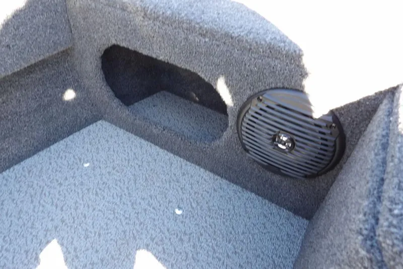 Slide: The Image of 2023 Lund 1675 Adventure SS boat interior with speaker and storage compartment. - 34