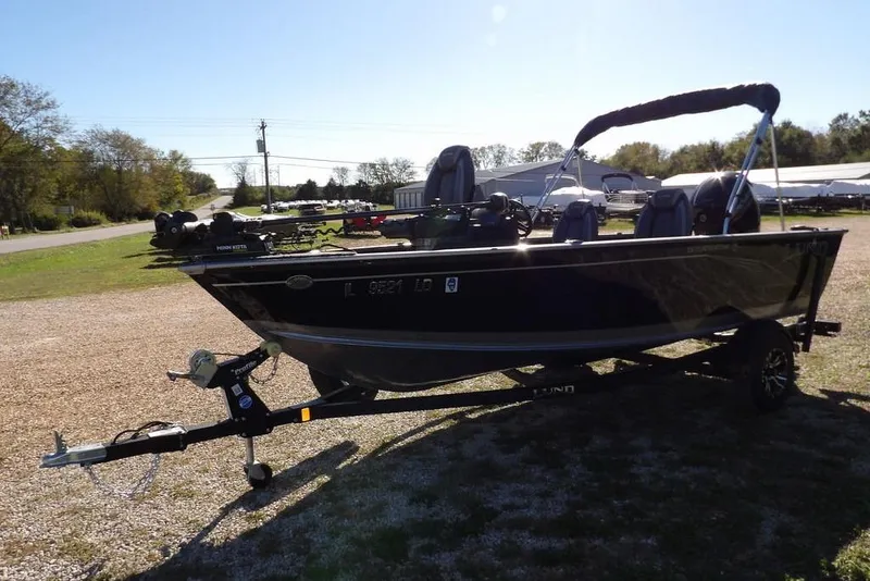 Slide: The Image of 2023 Lund 1675 Adventure SS boat on trailer, parked outdoors. - 4