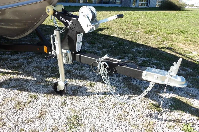 Slide: The Image of Trailer hitch of 2023 Lund 1675 Adventure SS boat on gravel surface. - 44