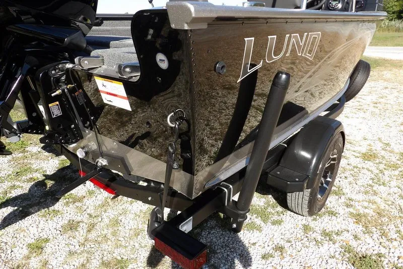 Slide: The Image of 2023 Lund 1675 Adventure SS boat on trailer, rear view, outdoors. - 46