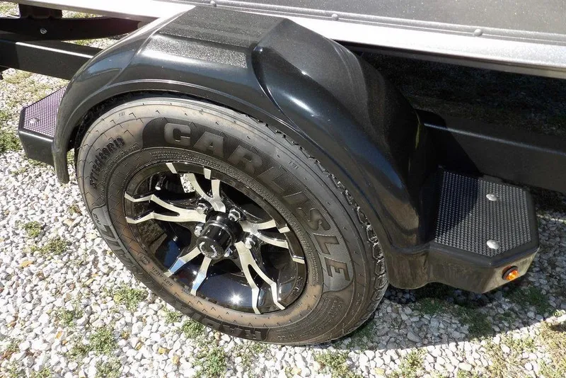 Slide: The Image of Trailer wheel of 2023 Lund 1675 Adventure SS on gravel surface. - 47