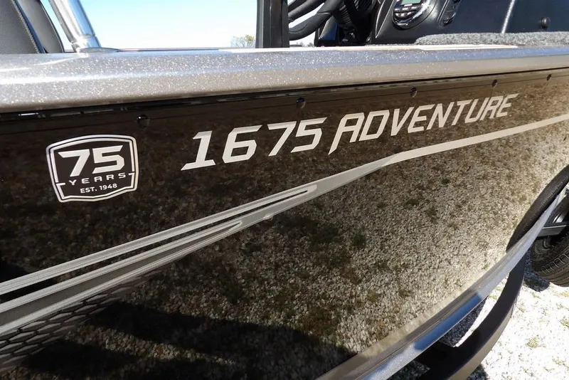 Slide: The Image of 2023 Lund 1675 Adventure SS boat, 75th anniversary edition, side view with logo. - 48