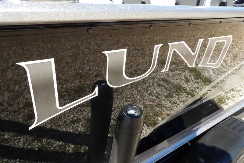 Slide: The Image of 2023 Lund 1675 Adventure SS boat logo on sleek exterior surface. - 49