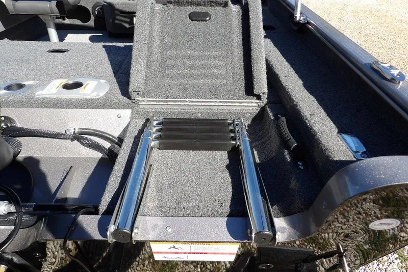 Slide: The Image of 2023 Lund 1675 Adventure SS boat with foldable ladder and carpeted deck. - 51