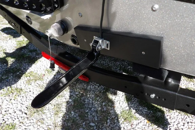 Slide: The Image of 2023 Lund 1675 Adventure SS boat trailer detail with black metal components. - 52