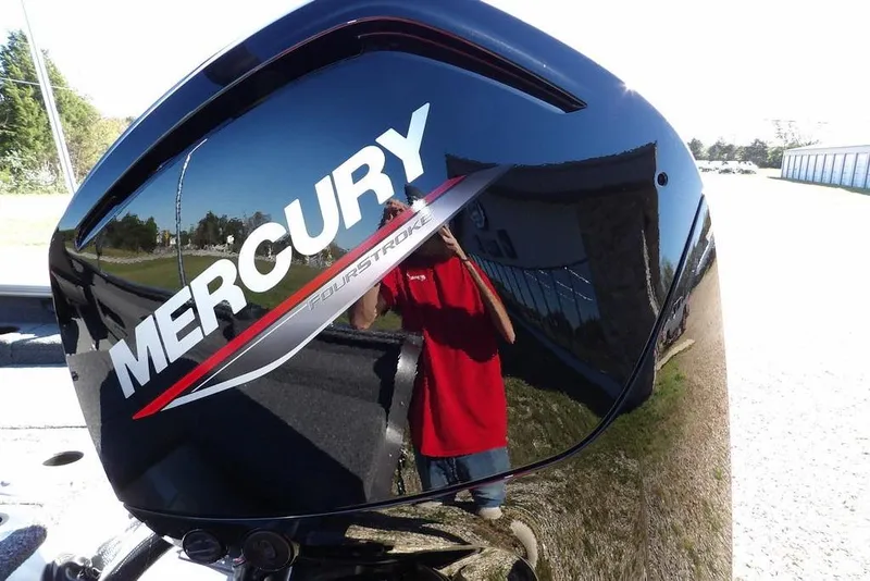 Slide: The Image of Mercury FourStroke engine on 2023 Lund 1675 Adventure SS boat, reflecting surroundings. - 54