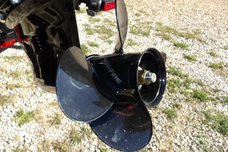 Slide: The Image of Propeller of 2023 Lund 1675 Adventure SS boat on gravel surface. - 56