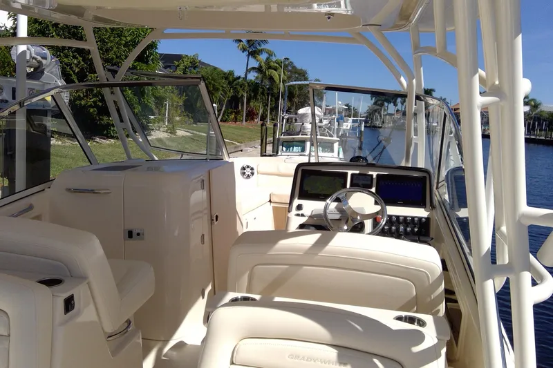 Slide: The Image of 2023 Grady-White Freedom 285 boat interior with steering console and seating. - 19