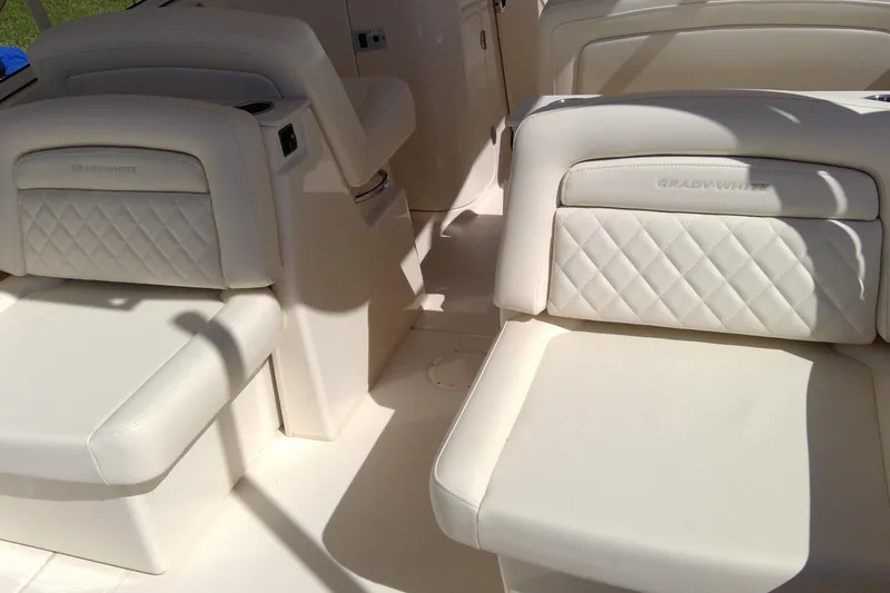 Slide: The Image of 2023 Grady-White Freedom 285 boat interior with luxurious white seating. - 21