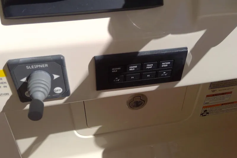 Slide: The Image of Control panel of 2023 Grady-White Freedom 285 boat with joystick and buttons. - 26