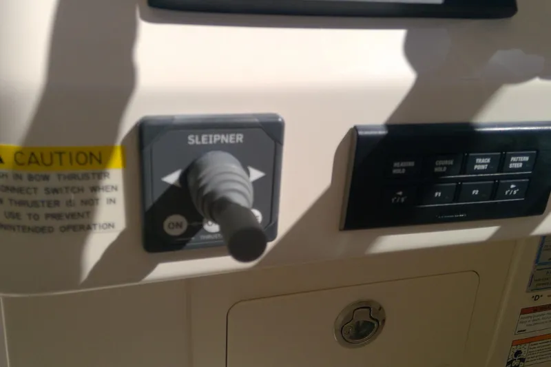 Slide: The Image of Control panel of 2023 Grady-White Freedom 285 boat with joystick and buttons. - 41