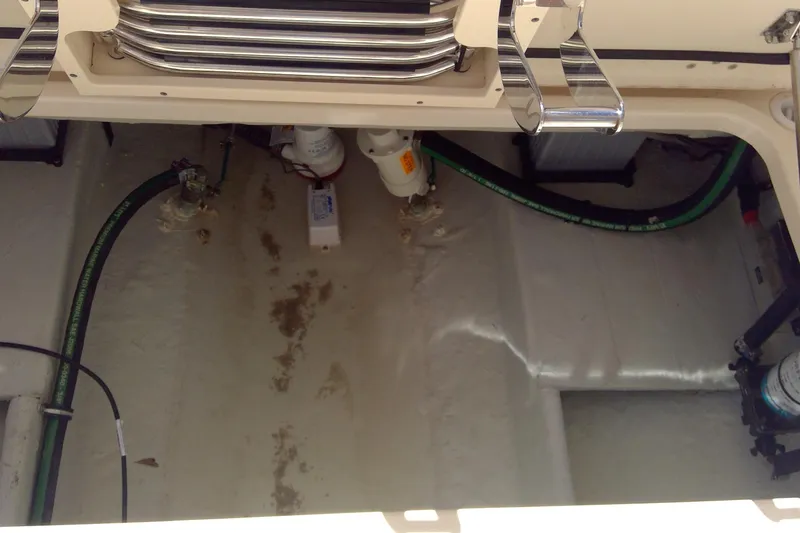 Slide: The Image of 2023 Grady-White Freedom 285 boat interior showing engine compartment details. - 44