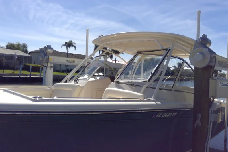 Slide: The Image of 2023 Grady-White Freedom 285 boat docked under clear blue sky. - 48