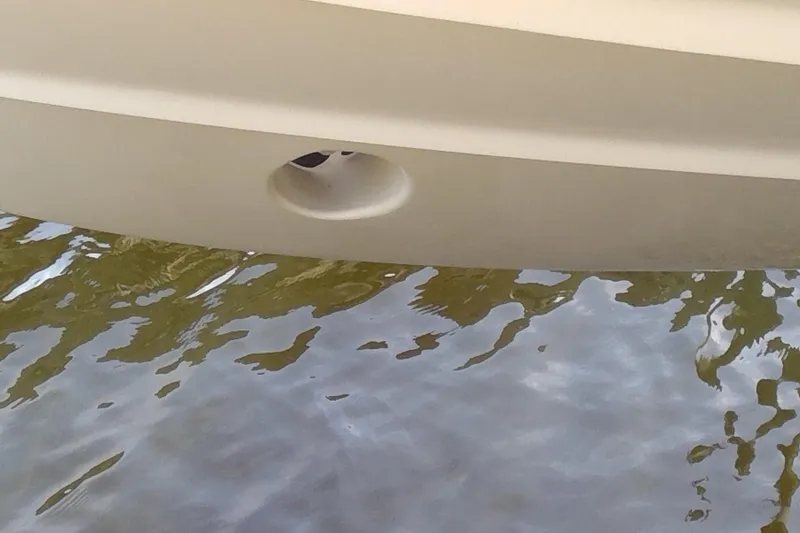 Slide: The Image of 2023 Grady-White Freedom 285 boat hull above water surface. - 49