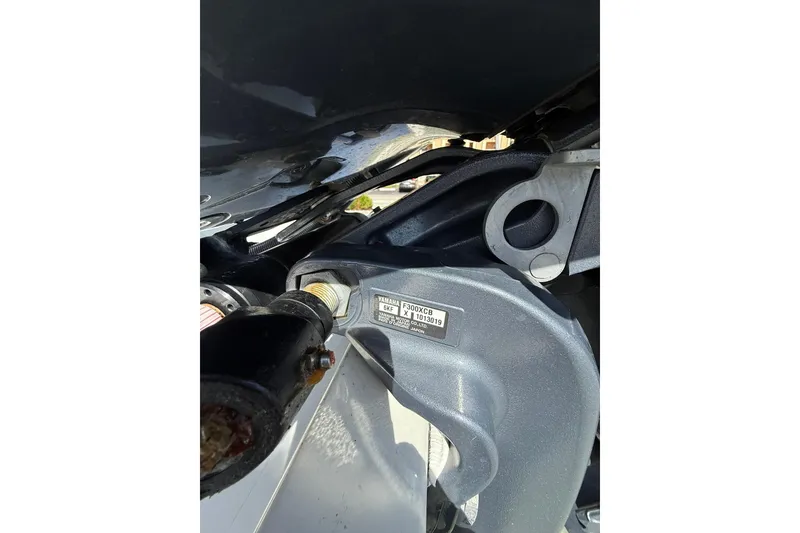 Slide: The Image of Close-up of a 2023 Parker 2320 Sport Cabin boat engine component. - 13