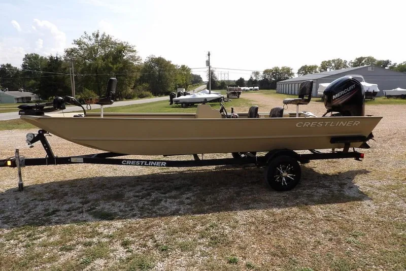 The Image of 2023 Crestliner 2070 Retriever SC boat on trailer, parked outdoors. - 1