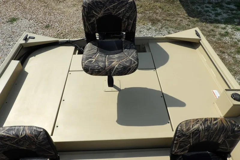 Slide: The Image of 2023 Crestliner 2070 Retriever SC boat interior with camo seats and spacious deck. - 10