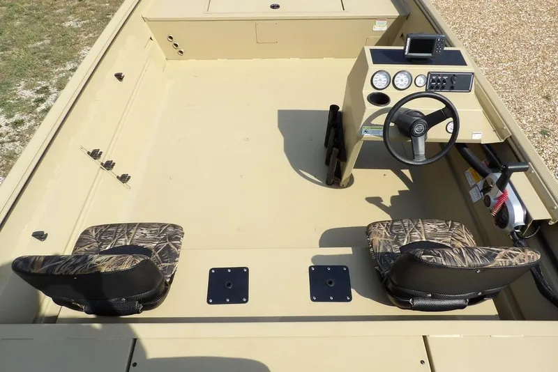 Slide: The Image of 2023 Crestliner 2070 Retriever SC boat interior with camo seats and steering console. - 11