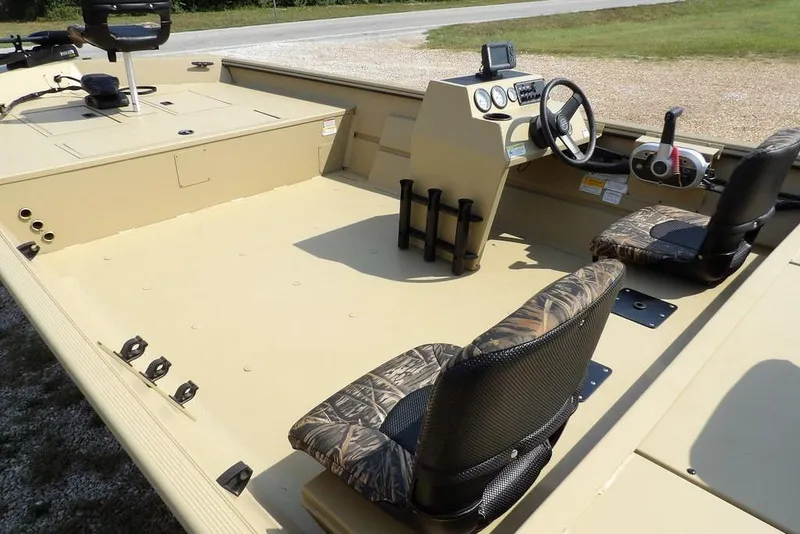 Slide: The Image of 2023 Crestliner 2070 Retriever SC boat interior with steering console and camo seats. - 13