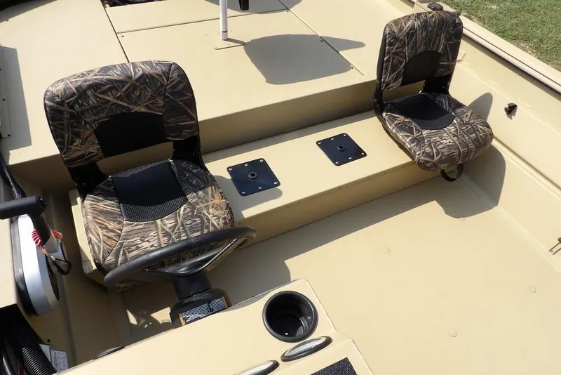 Slide: The Image of 2023 Crestliner 2070 Retriever SC boat interior with camo seats and steering wheel. - 14
