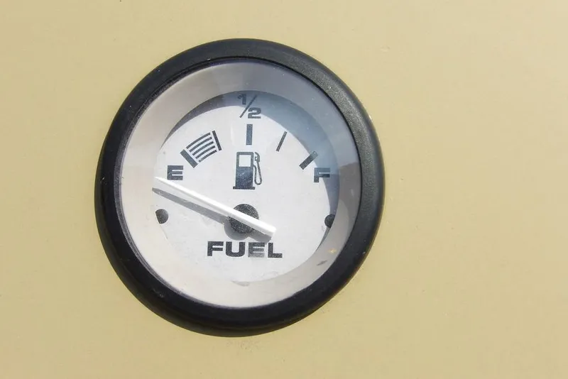 Slide: The Image of Fuel gauge of 2023 Crestliner 2070 Retriever SC, showing near empty. - 17