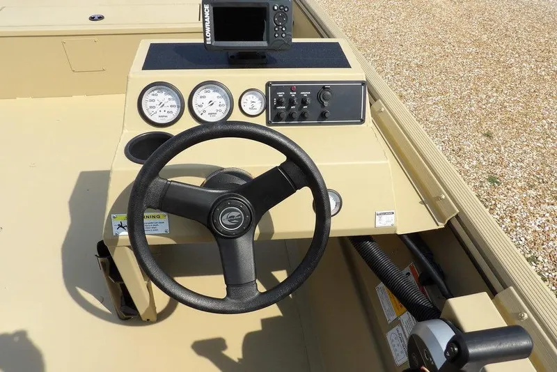 Slide: The Image of 2023 Crestliner 2070 Retriever SC boat dashboard with steering wheel and gauges. - 18