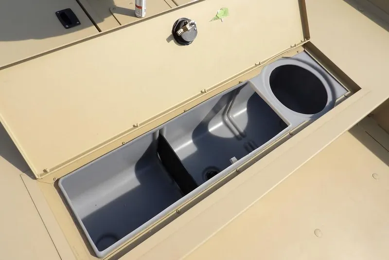 Slide: The Image of 2023 Crestliner 2070 Retriever SC boat storage compartment with open lid. - 19