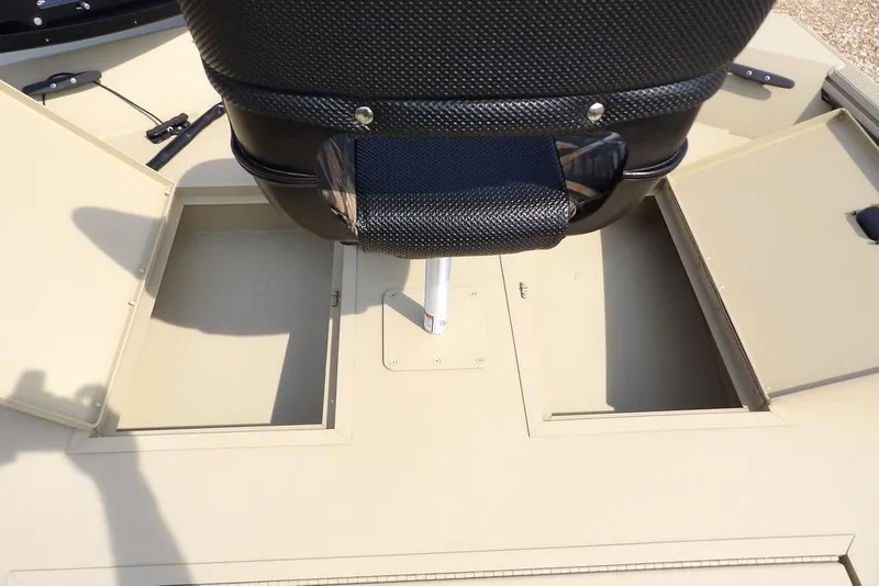 Slide: The Image of 2023 Crestliner 2070 Retriever SC boat with open storage compartments and seat. - 20