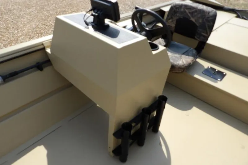 Slide: The Image of 2023 Crestliner 2070 Retriever SC boat interior with steering console and camo seat. - 22