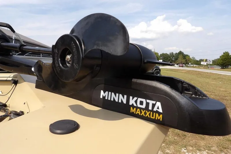 Slide: The Image of Minn Kota Maxxum motor on 2023 Crestliner 2070 Retriever SC boat, outdoor setting. - 28
