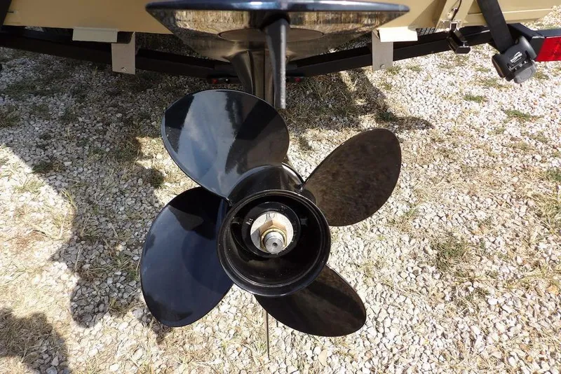 Slide: The Image of Propeller of 2023 Crestliner 2070 Retriever SC boat on gravel surface. - 29