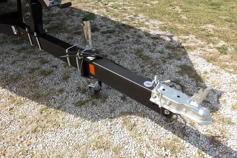 Slide: The Image of Trailer hitch of 2023 Crestliner 2070 Retriever SC on gravel surface. - 35