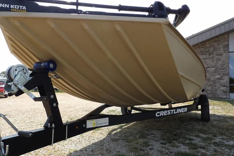 Slide: The Image of 2023 Crestliner 2070 Retriever SC boat on trailer, displayed outdoors. - 36