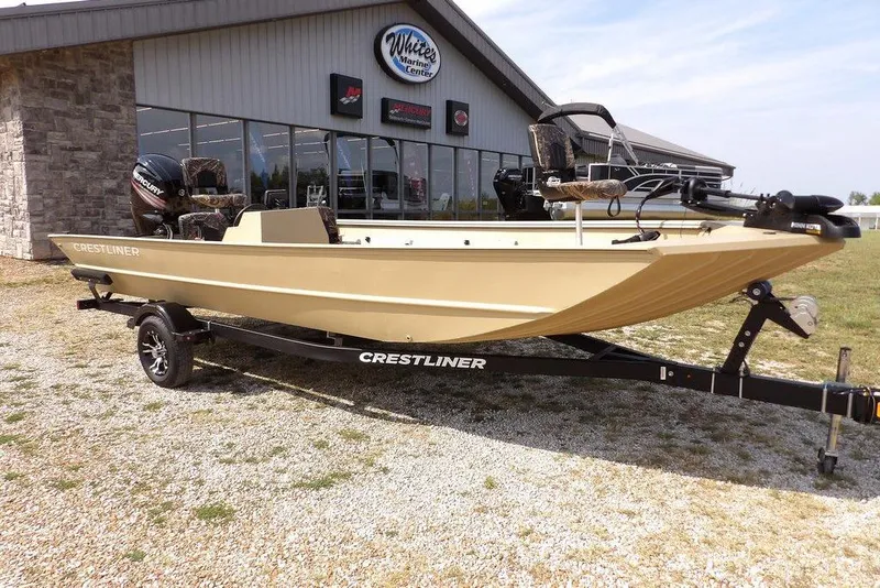 Slide: The Image of 2023 Crestliner 2070 Retriever SC boat on trailer outside marine center. - 4