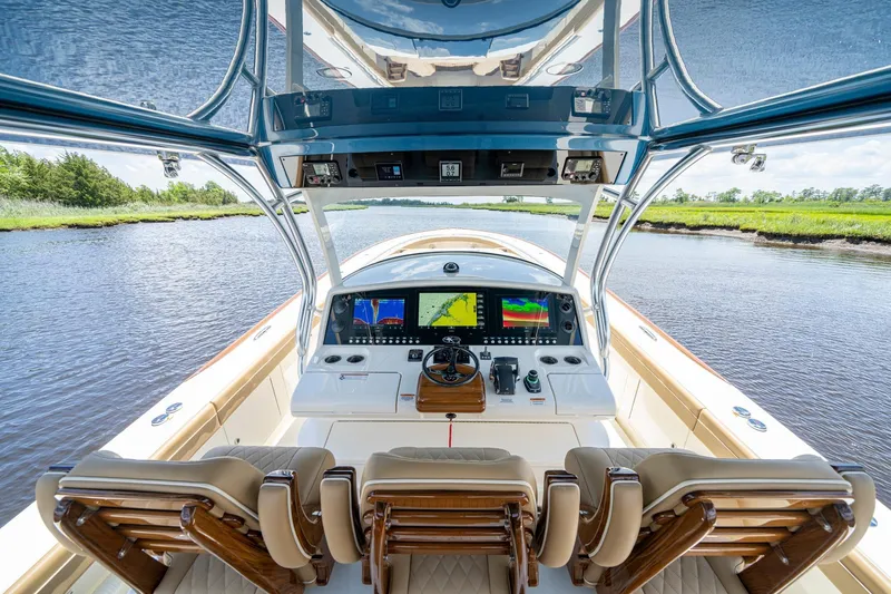 Slide: The Image of 2023 Valhalla Boatworks V-46 interior with luxurious seating and modern controls. - 10